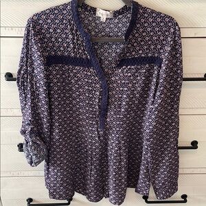 Bailey + Chloe relaxed tunic with roll tab sleeves. Embroidered detail.